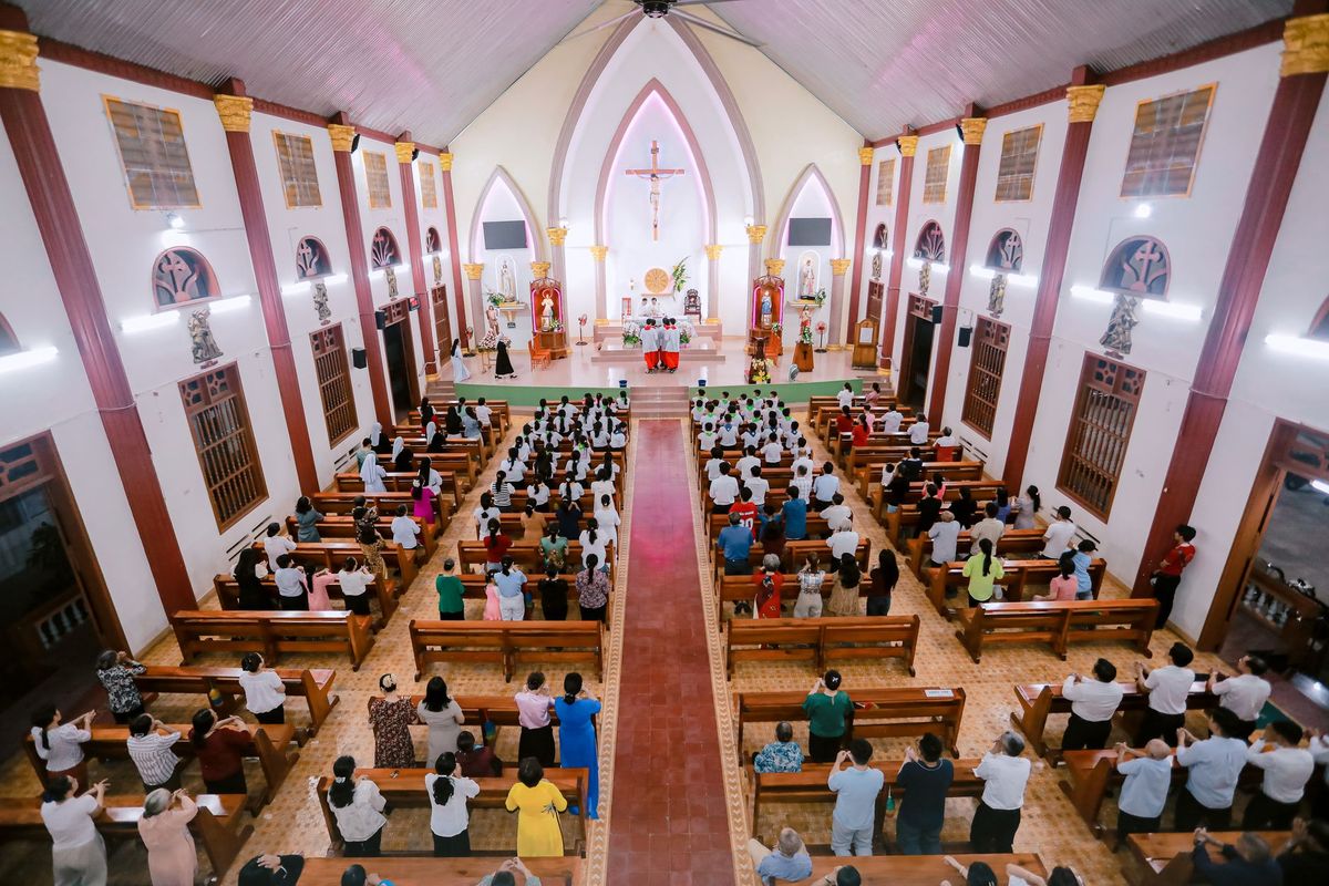 Mourners file into a church in Haiti where gangs killed dozens of people in latest rampage